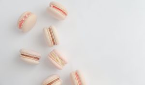 a group of macaroons sitting on top of a white table